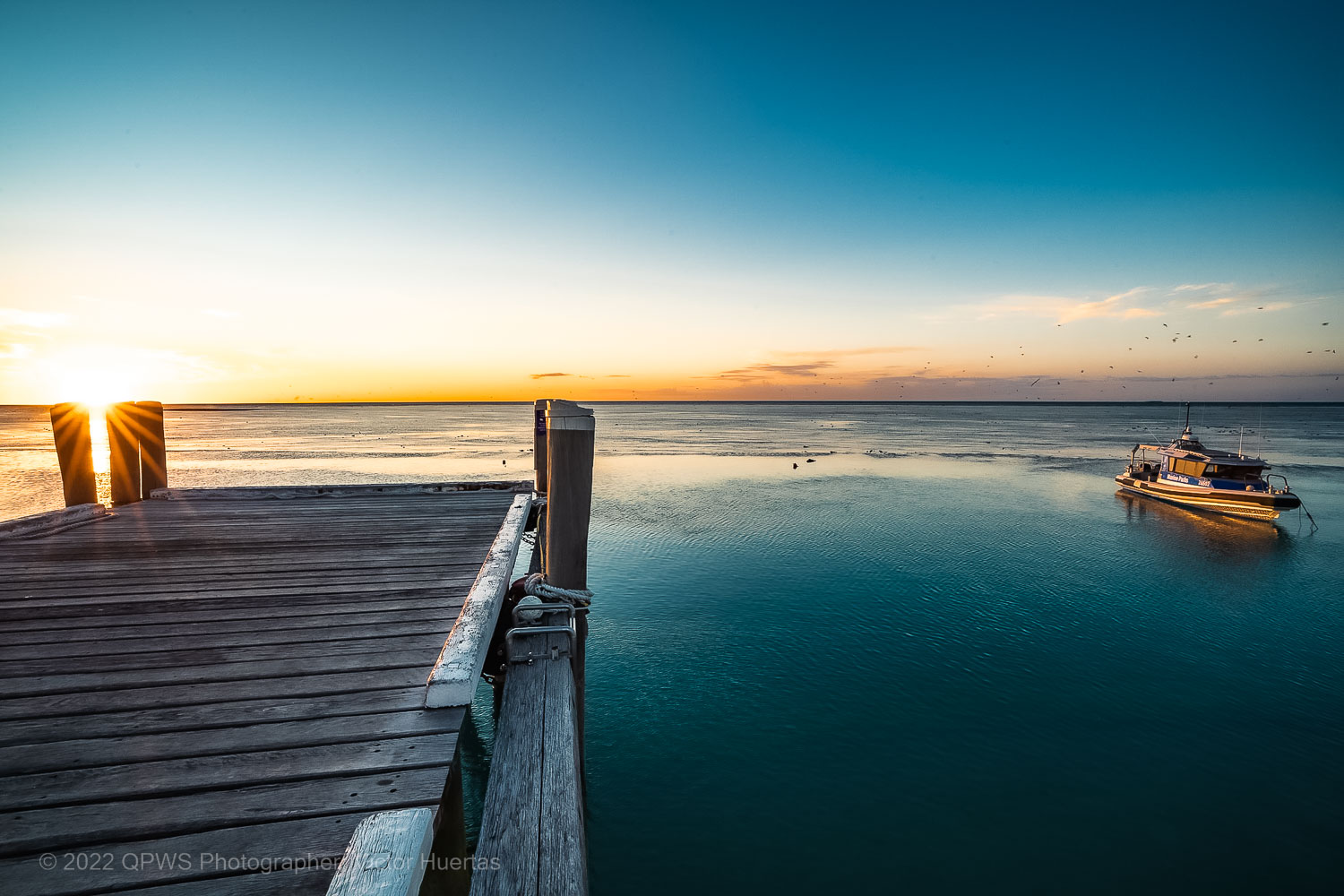 Marine Parks boat and a sunset – Australia - © QPWS - Photographer: Victor Huertas
