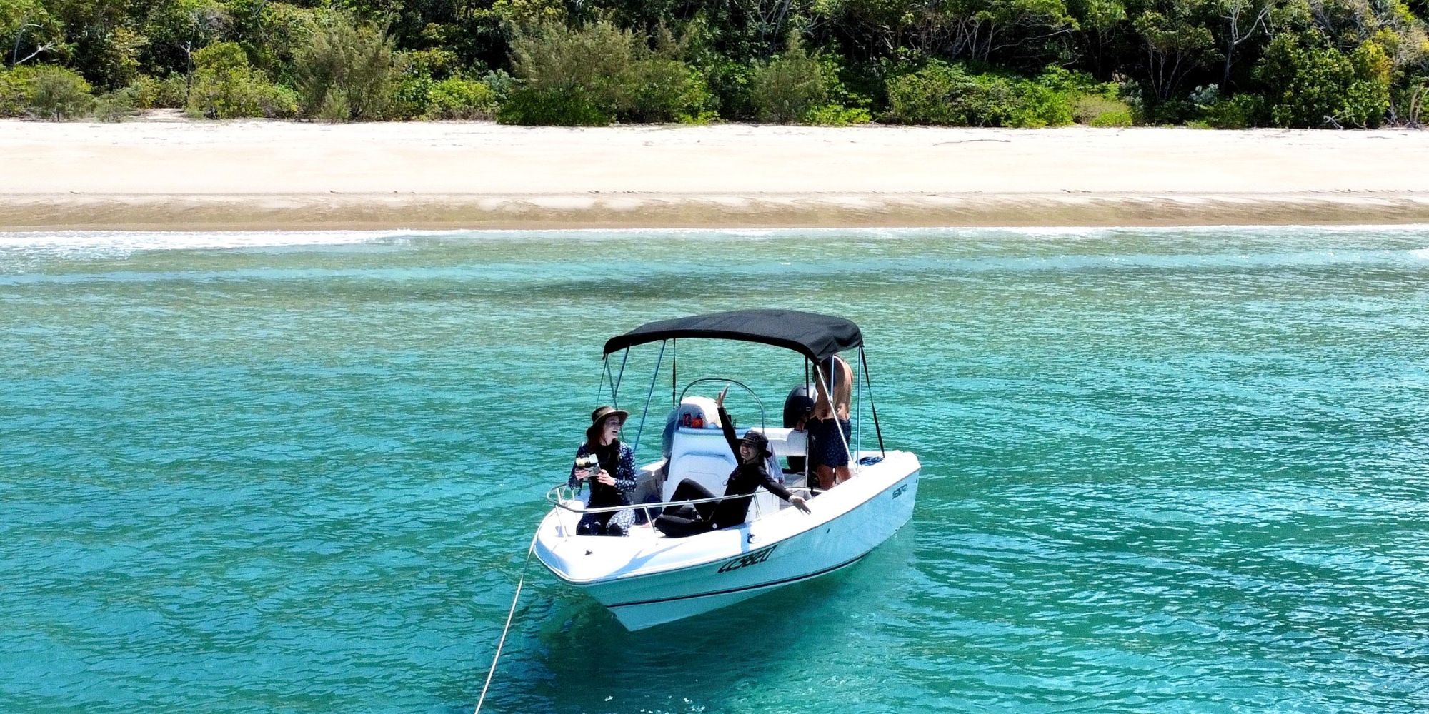 People on a boat near an island