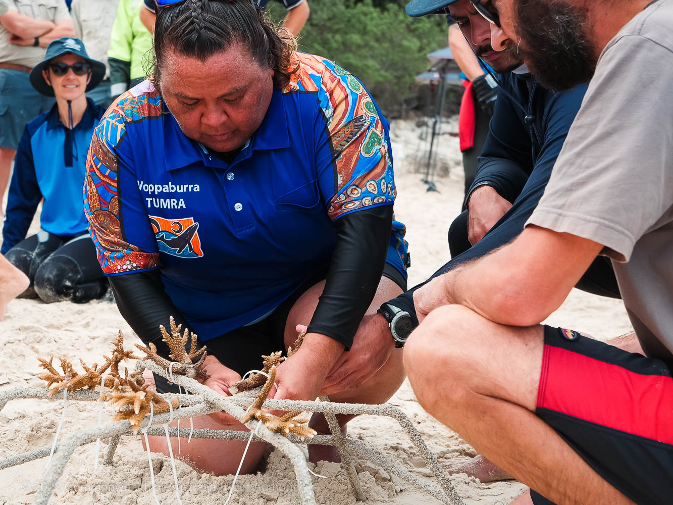 © Commonwealth of Australia (Reef Authority) - Woppaburra TUMRA Aboriginal Corporation Chair, Meaghan Cummins ties live coral fragments to a MARS Reef Star