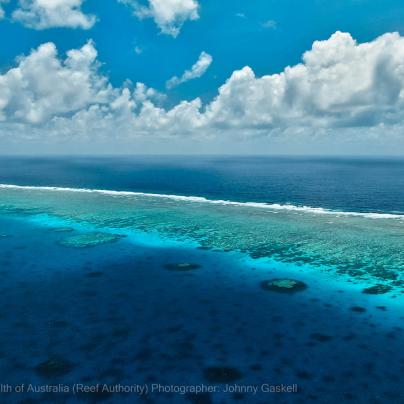 Aerial photograph of the Great Barrier Reef and deep ocean – © Commonwealth of Australia – (Reef Authority) - Photographer: Johnny Gaskell