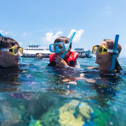 Family snorkeling in the Great Barrier Reef Marine Park  – Australia - © Tourism and Events Queensland
