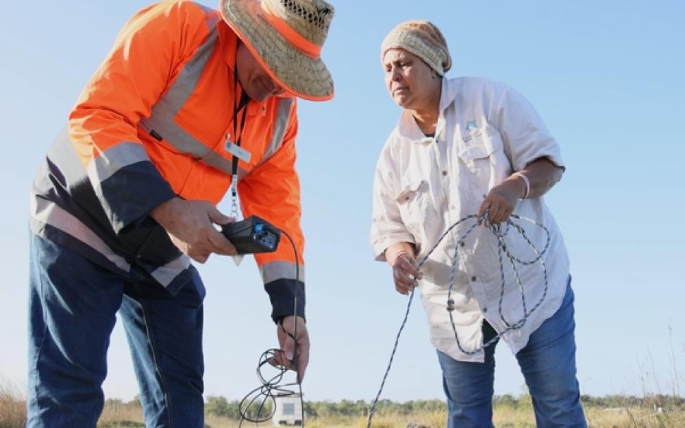 A council worker and Traditional Owner conducting water testing